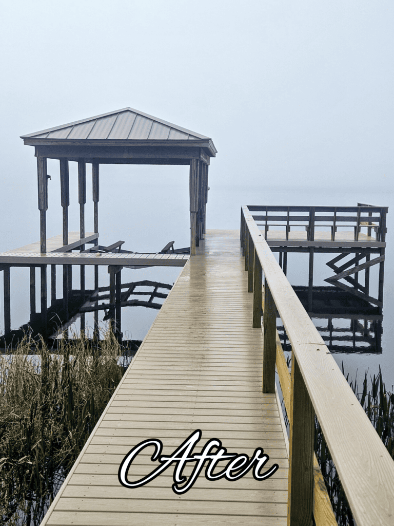Wooden dock and covered boat slip in fog